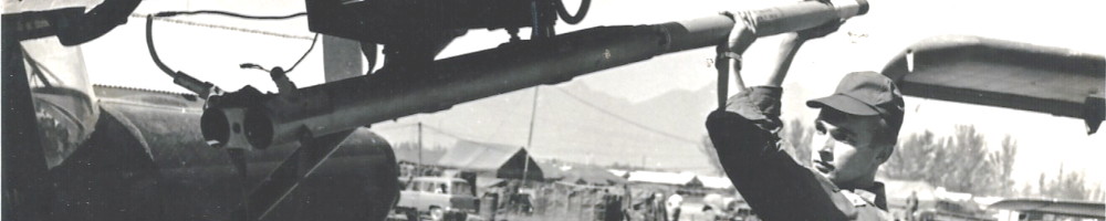 Official Marine photograph of SP4 Joseph C. Kemper loading a rocket on 11 January 1966, Da Nang