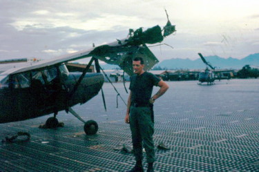 Roger Putnam at Marble Mountain airport, 1966, following a mortar attack