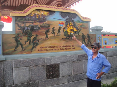 My rickshaw driver pointing to mural depicting the NVA overrunning the airfield the night the Tet offensive started. The father of our driver was a security guard at the airfield and killed during the battle. Their family house was burned to the ground and two uncles were taken by the NVA and never seen again.