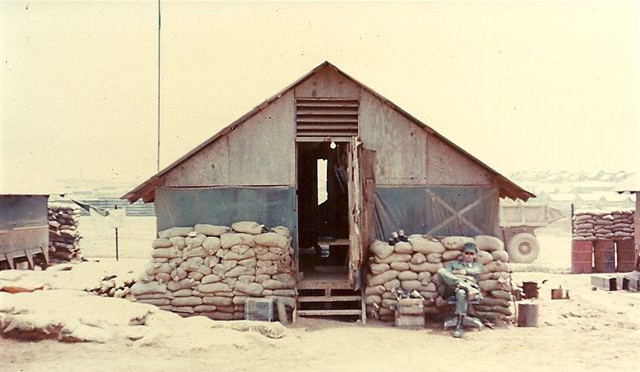 Ray Caryl photo: Dong Ha Line Shack, Tony Keltner in chair, 1968