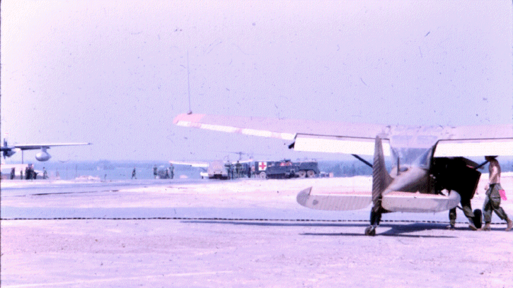 Bill Hooper landing to receive medical attention after being severely wounded inflight. Photo courtesy Jim Lawrence