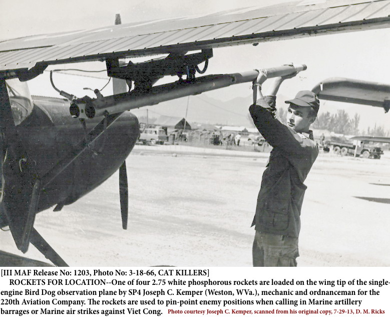 SP4 Joseph Clark Kemper loading a 2.75 on a mission Birddog before departure