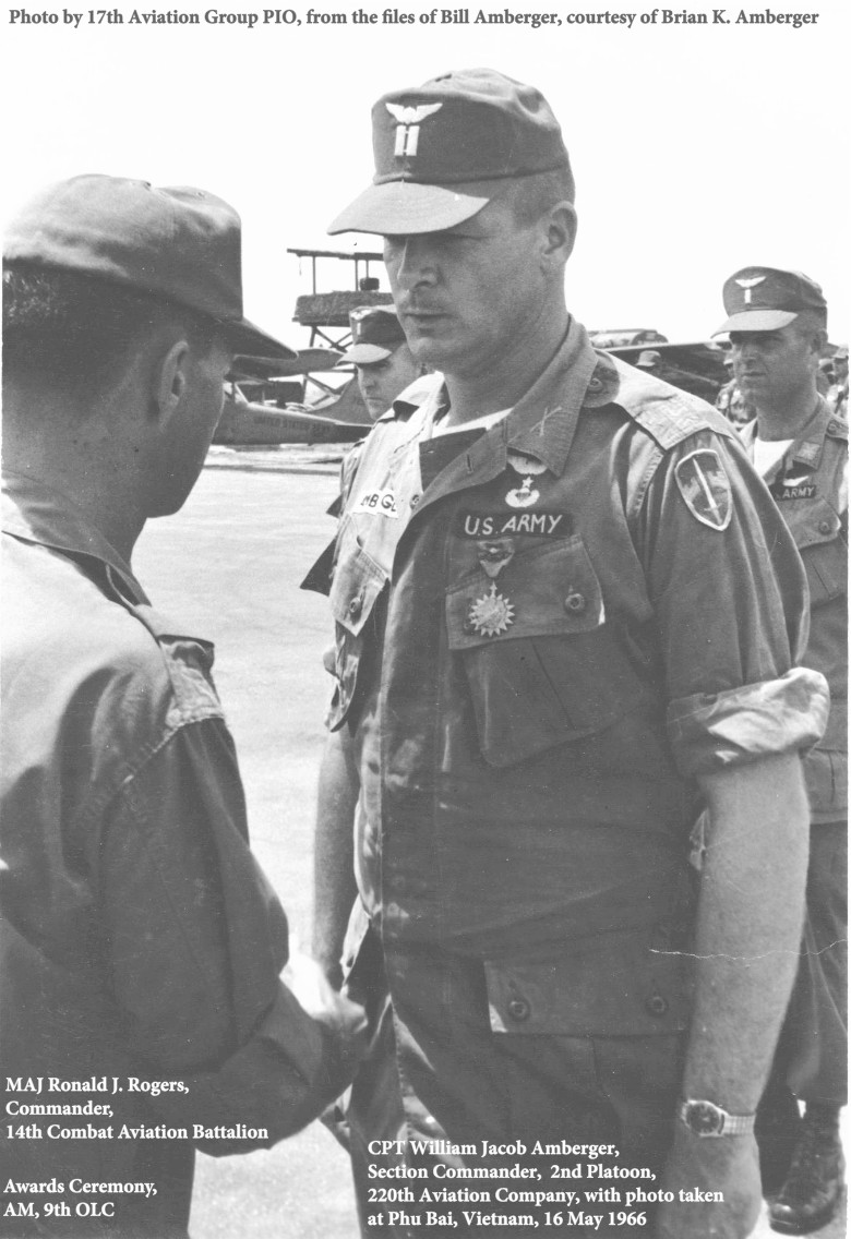 MAJ Ronald J. Rogers, Cdr, 14th CAB, awards the AM (9th OLC) to CPT William J. Amberger at Phu Bai, 13 May 1966 MAJ Ronald J. Rogers, Cdr, 14th CAB, awards the AM (9th OLC) to CPT William J. Amberger at Phu Bai, 13 May 1966